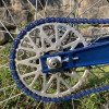 blue swingarm on bike axle